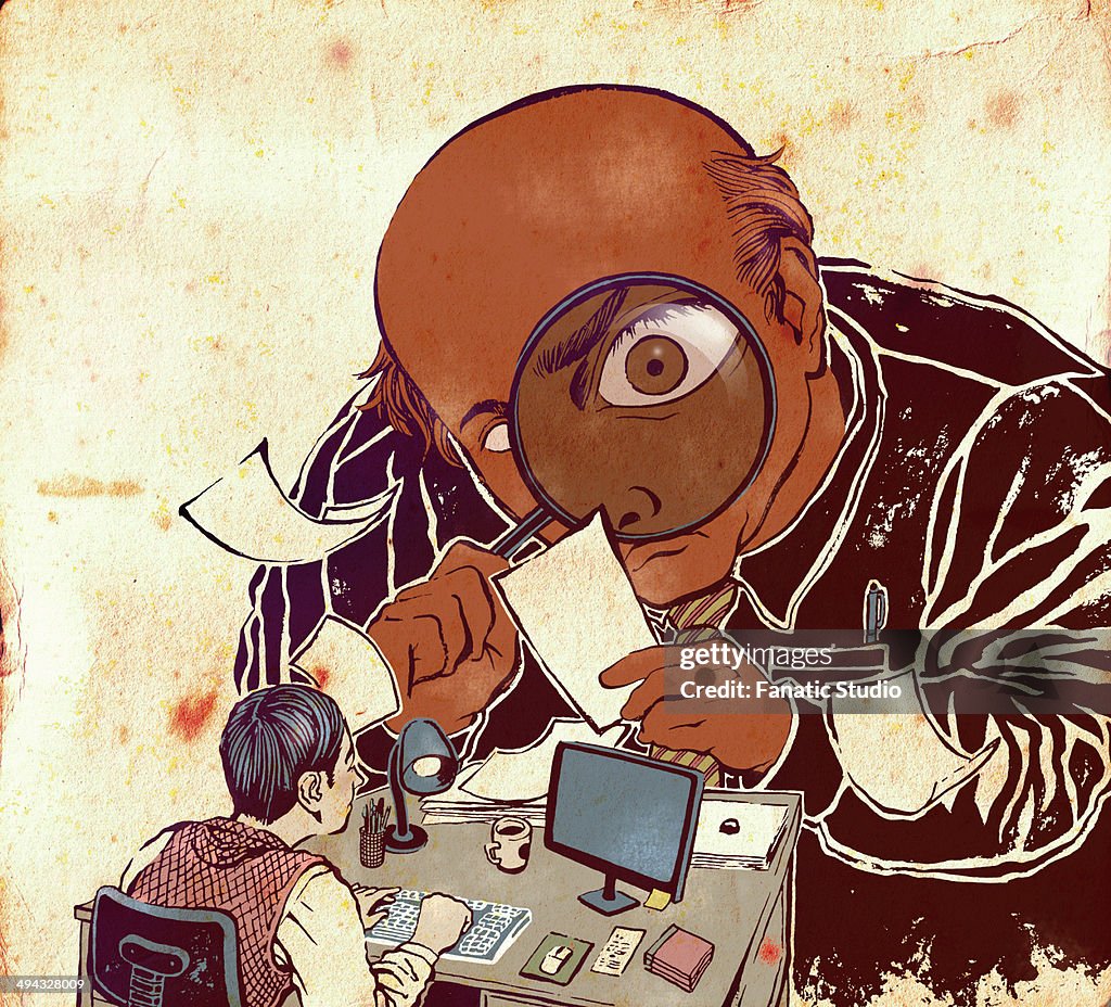 Big boss examining documents in an office