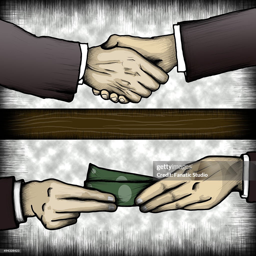 Businessman handing money under table to co-worker