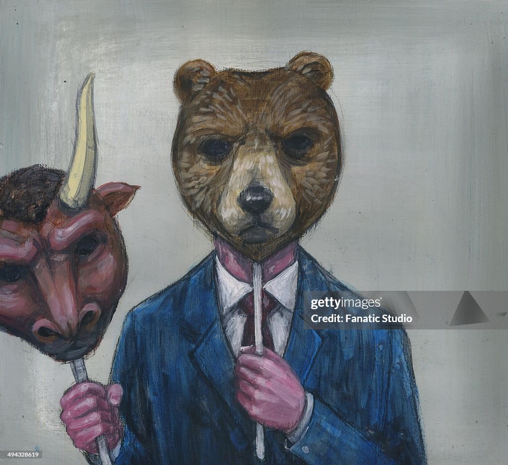 Deceptive image of man holding bull mask while wearing bear mask