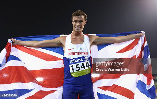 Paul Blake of Great Britain celebrates winning the men's 800m T36 final during the Evening Session on Day Five of the IPC Athletics World...