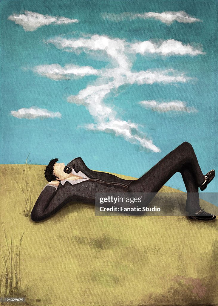 Illustrative image of businessman lying on grass while thinking about money representing aim