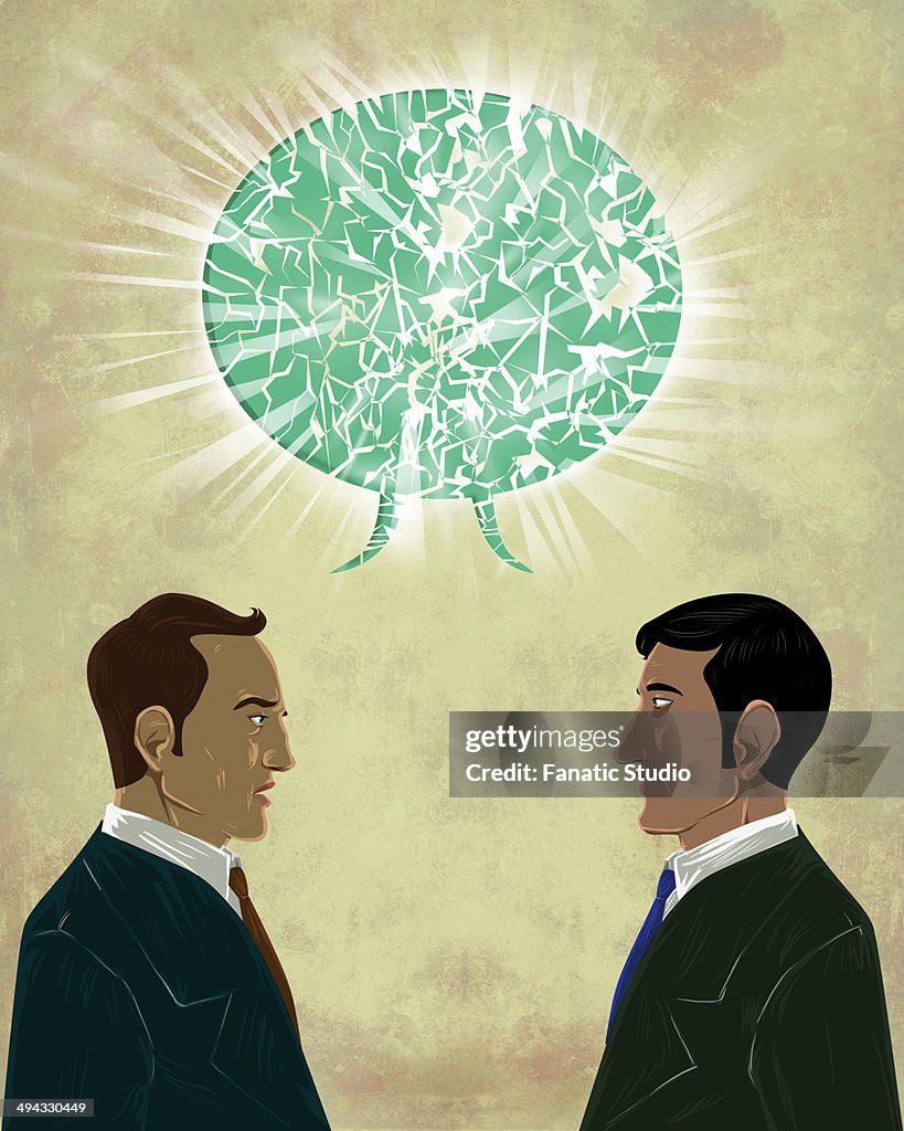 Illustrative image of businessmen with talk bubble representing miscommunication