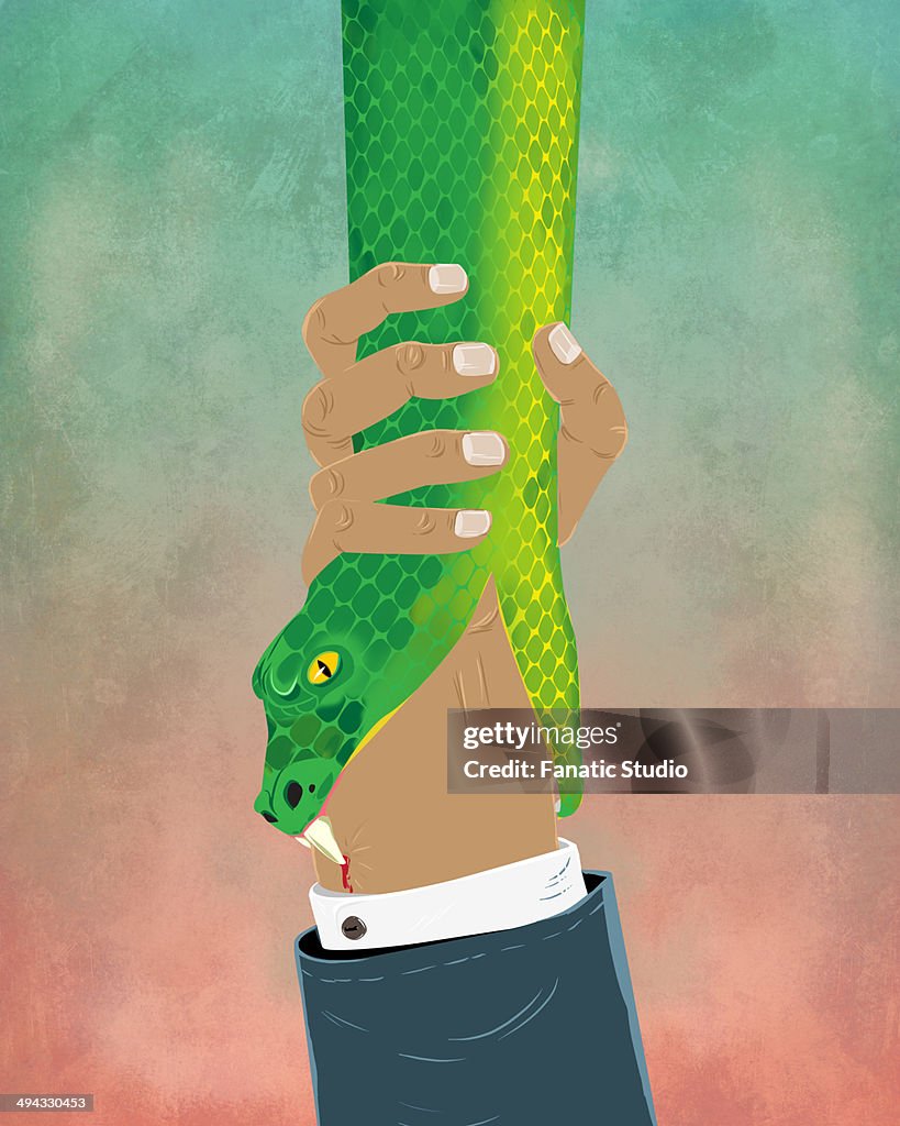 Illustrative image of businessman's hand holding snake representing business crime