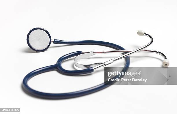 blue stethoscope on white background - stethoskop stock-fotos und bilder