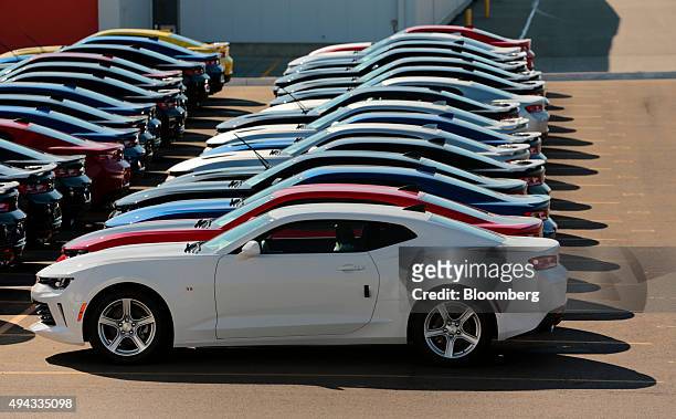 Chevrolet Camaros sit parked outside before being shipped to dealers from the General Motors Co. Lansing Grand River Assembly plant in Lansing,...