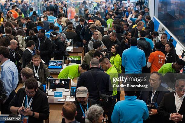 Employees assist customers during the opening of the first Microsoft Corp. Store in New York, U.S., on Monday, Oct. 26, 2015. In the making for more...