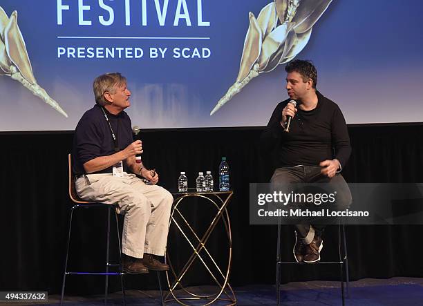 Director Evgeny Afineevksy speaks on stage with SCAD Professor Kevin McCarey during Q&A for "Winter on Fire" at SCAD Museum of Arts during Day Three...