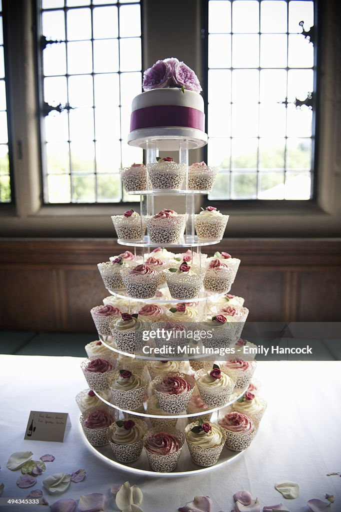 Frosted cupcakes on a seven tier cake stand, a cupcake wedding cake.
