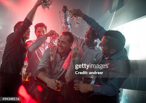 Happy group of men at a bachelor party Happy group of men at a bachelor party