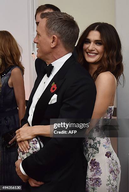 British actor Daniel Craig and his partner Rachel Weisz stand before the world premiere of the new James Bond film 'Spectre' at the Royal Albert Hall...