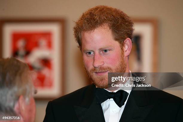 Prince Harry meets charity representatives as he attends The Cinema and Television Benevolent Fund's Royal Film Performance 2015 of the 24th James...