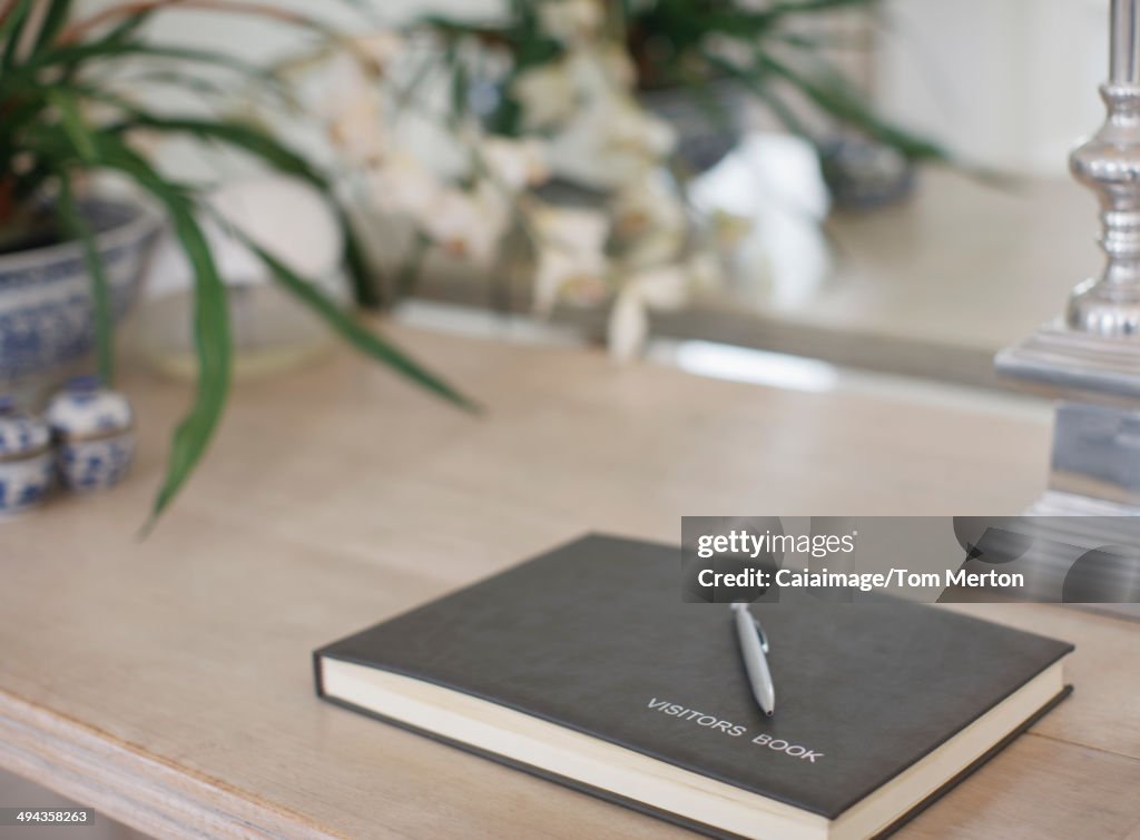 Visitors book on table in bed and breakfast