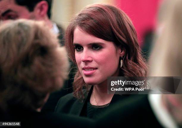 Princess Eugenie speaks to guests during a reception for The Queen Elizabeth Prize for Engineering in the Throne Room at Buckingham Palace on October...