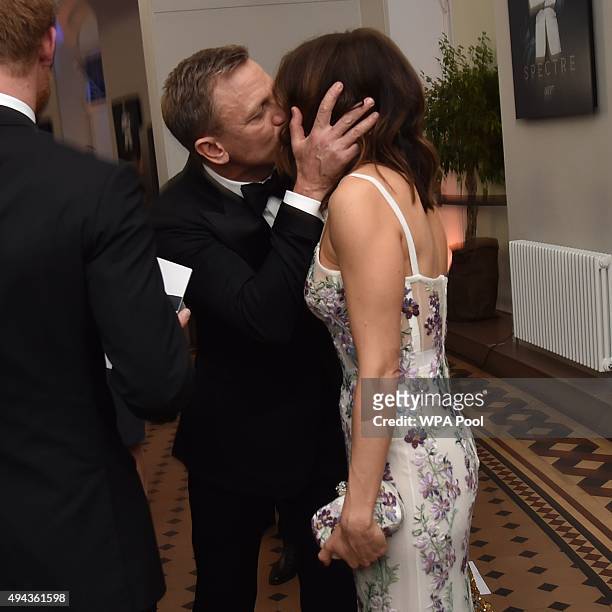 Daniel Craig kisses his wife actress Rachel Weisz while they attend The Cinema and Television Benevolent Fund's Royal Film Performance 2015 of the...