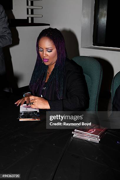 Singer Lalah Hathaway autographs a copy of her cd LIVE, during 'The Experience With Lalah Hathaway' at the DuSable Museum on October 23, 2015 in...