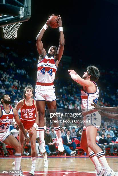 Rick Mahorn of the Washington Bullets grabs a rebound against the Houston Rockets during an NBA basketball game circa 1983 at the Capital Centre in...