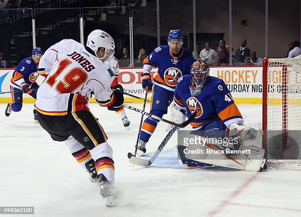 Jaroslav Halak of the New York Islanders makes the first period stop on David Jones of the Calgary Flames at the Barclays Center on October 26, 2015...