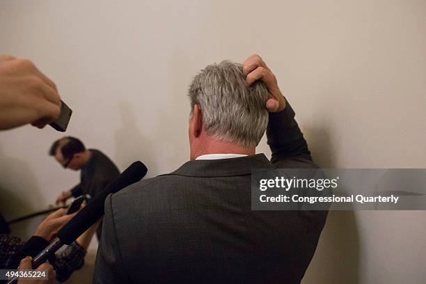 House Majority Leader Kevin McCarthy, R-Calif., scratches his head as he is swarmed by reporters while leaving the office of Speaker John Boehner,...