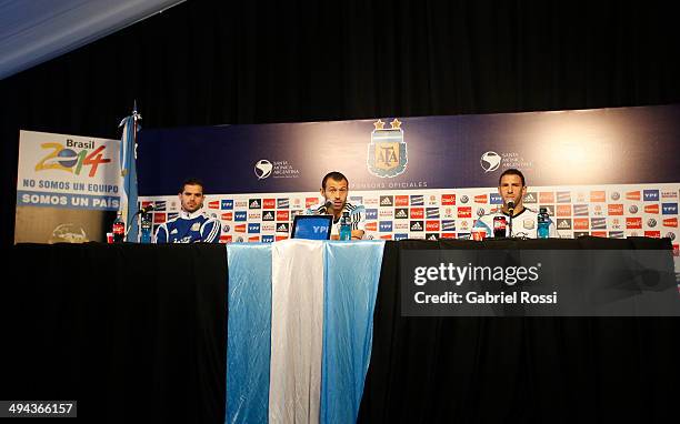 Javier Mascherano speaks during a press conference joined by Maximiliano Rodriguez and Fernando Gago at Ezeiza Training Camp on May 28, 2014 in...