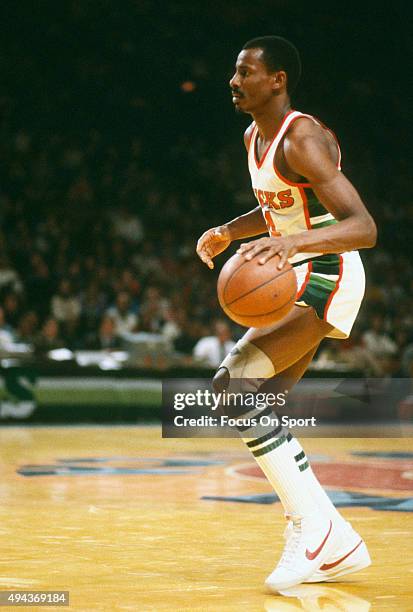Sidney Moncrief of the Milwaukee Bucks dribbles the ball during an NBA basketball game circa 1983 at the MECCA Arena in Milwaukee, Wisconsin....