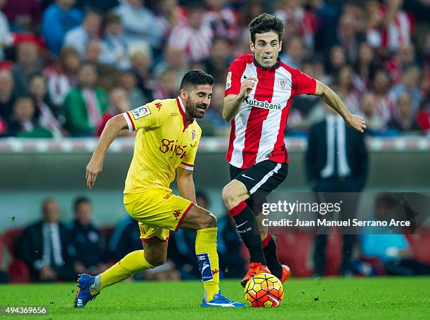 Markel Susaeta of Athletic Club duels for the ball with Carlos Carmona of Real Sporting de Gijon during the La Liga match between Athletic Club and...