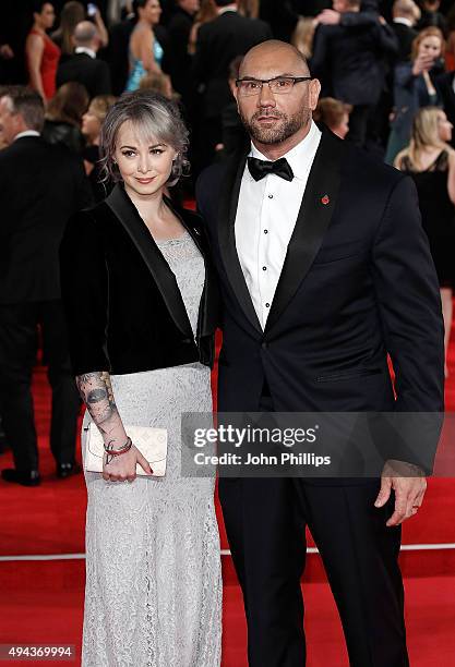 Dave Bautista and Sarah Jade attend the Royal Film Performance of "Spectre" at Royal Albert Hall on October 26, 2015 in London, England.