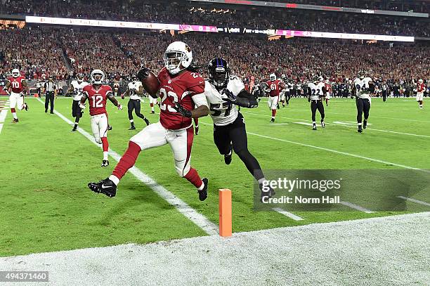 Running back Chris Johnson of the Arizona Cardinals runs in a 26 yard touchdown against linebacker C.J. Mosley of the Baltimore Ravens in the first...