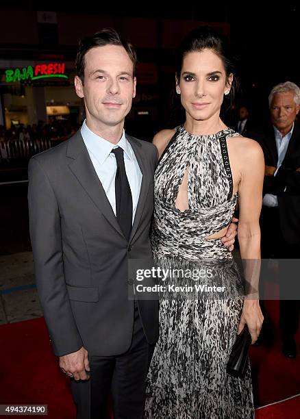 Actors Scoot McNairy and Sandra Bullock attend the premiere of Warner Bros. Pictures' "Our Brand Is Crisis" at TCL Chinese Theatre on October 26,...