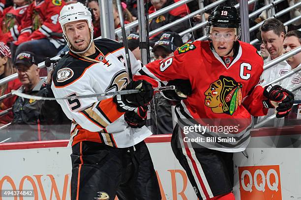 Ryan Getzlaf of the Anaheim Ducks and Jonathan Toews of the Chicago Blackhawks get physical in the second period of the NHL game at the United Center...