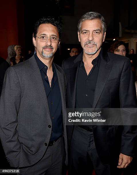 Producers Grant Heslov and George Clooney attend the premiere of Warner Bros. Pictures' "Our Brand Is Crisis" at TCL Chinese Theatre on October 26,...
