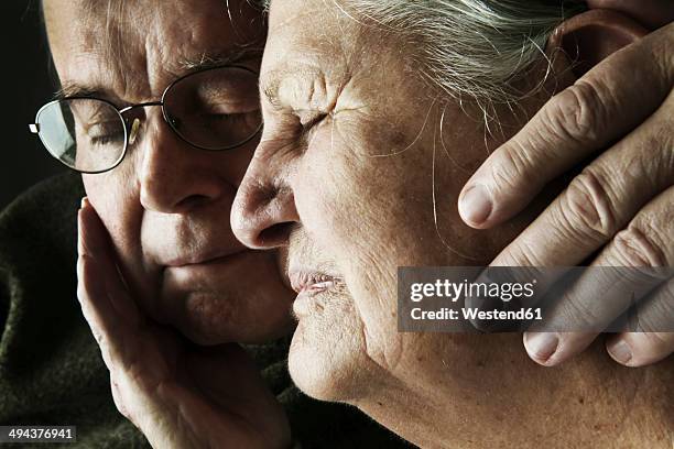 portrait of senior couple with close eyes, close-up - love emotion stock pictures, royalty-free photos & images