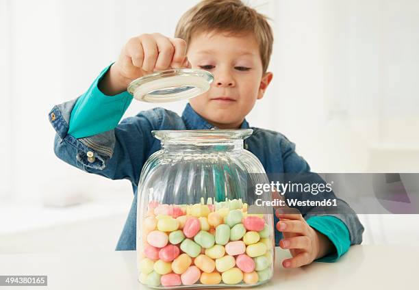 germany, munich, boy with candy jar - tag 7 bildbanksfoton och bilder