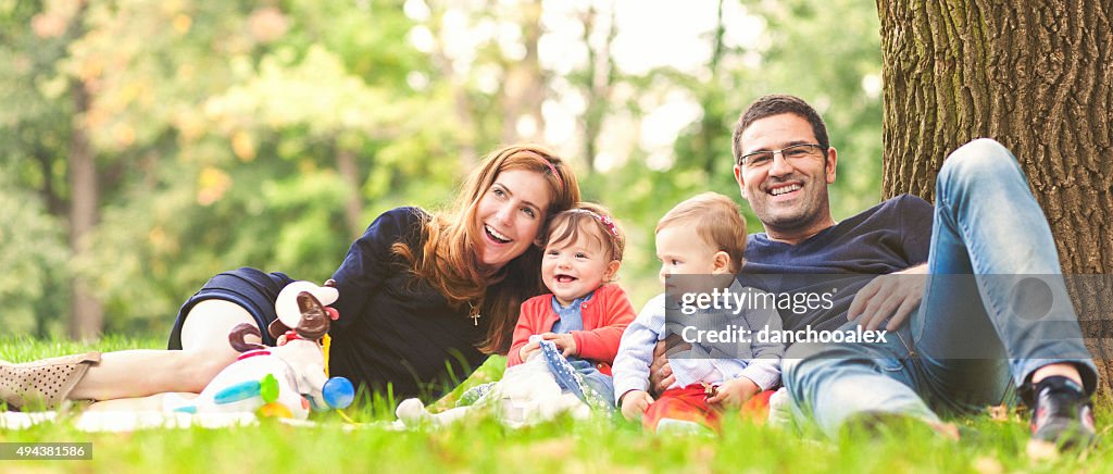 Happy family outdoors in nature laughing