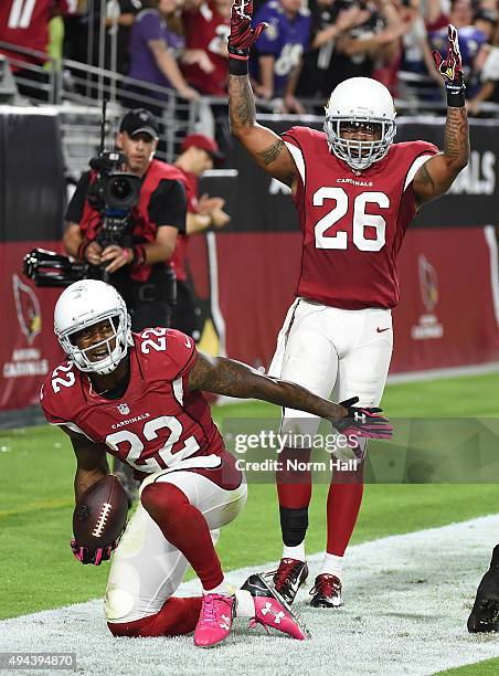 Tony Jefferson and teammate Rashad Johnson of the Arizona Cardinals celebrate after intercepting a pass in the final seconds of a game against the...