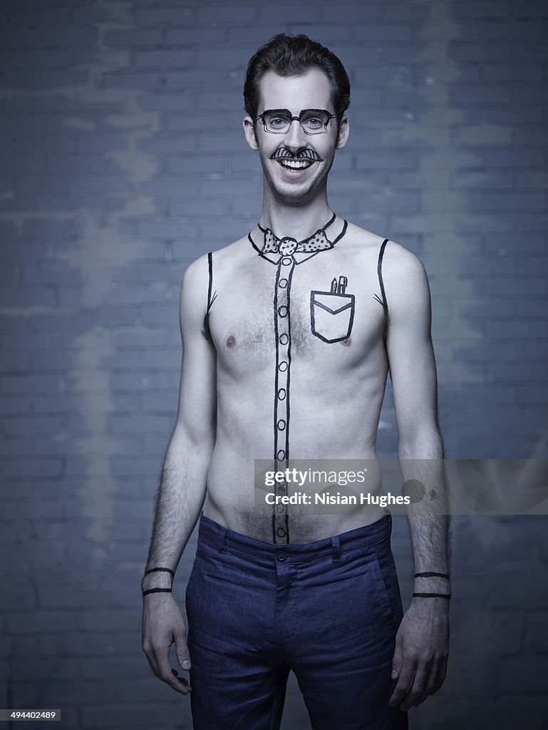 Young man with black outline drawings on him