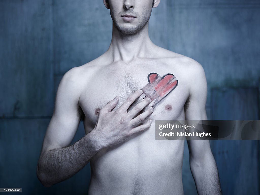 Man with red heart smeared across his chest