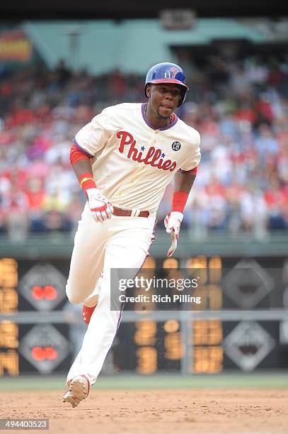 John Mayberry Jr. #15 of the Philadelphia Phillies runs during the game against the Cincinnati Reds on May 18, 2014 at Citizens Bank Park in...