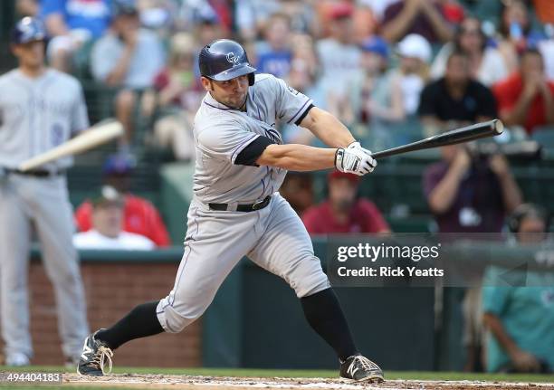 Michael McKenry of the Colorado Rockies hits in the second inning against the Texas Rangers at Globe Life Park in Arlington on May 7, 2014 in...