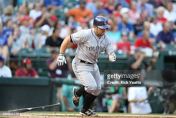 Michael McKenry of the Colorado Rockies hits in the second inning against the Texas Rangers at Globe Life Park in Arlington on May 7, 2014 in...