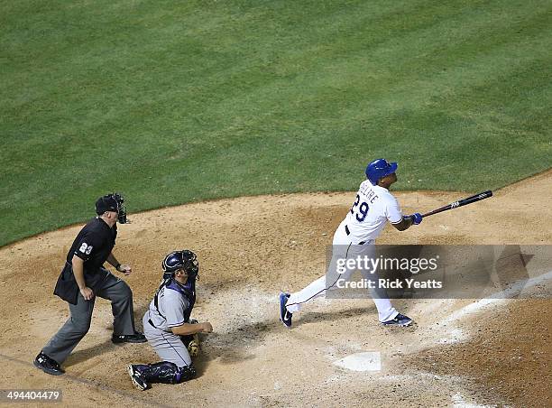 Lance Barksdale umpire and Michael McKenry of the Colorado Rockies look on as Adrian Beltre of the Texas Rangers hits a home run in the fourth inning...