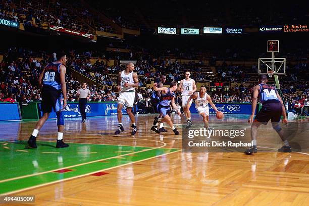 David Wesley of the Boston Celtics drives against the Cleveland Cavilers during a game played in 1995 at the Boston Garden in Boston, Massachusetts....