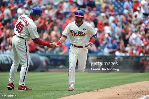 Will Nieves of the Philadelphia Phillies is congratulated after hitting a home run during the game against the Cincinnati Reds on May 18, 2014 at...