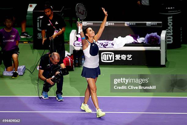 Flavia Pennetta of Italy celebrates after defeating Agnieszka Radwanska of Poland in a round robin match during the BNP Paribas WTA Finals at...