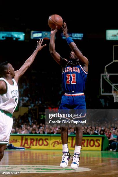 Terrell Brandon of the Cleveland Cavaliers shoots against Dee Brown of the Boston Celtics during a game played in 1992 at the Boston Garden in...