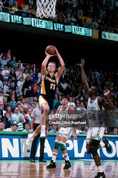 Detlef Schrempf of the Indiana Pacers shoots against the Boston Celtics during a game played in 1992 at the Boston Garden in Boston, Massachusetts....