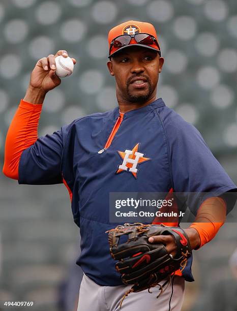 Manager Bo Porter of the Houston Astros plays catch during batting practice prior to the game against the Seattle Mariners at Safeco Field on May 22,...