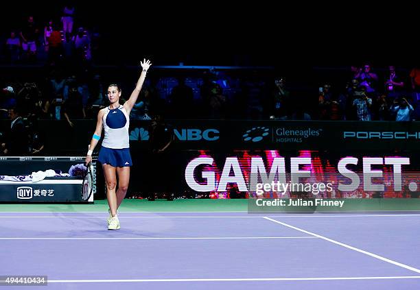 Flavia Pennetta of Italy celebrates after defeating Agnieszka Radwanska of Poland in a round robin match during the BNP Paribas WTA Finals at...