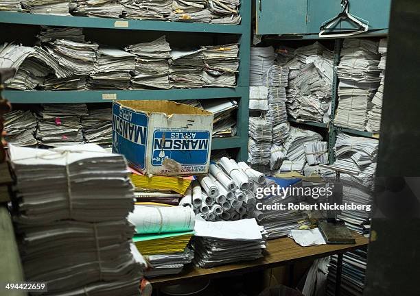 Papers and files are piled in a storage room at a cultural center March 4, 2014 in New Delhi, India.