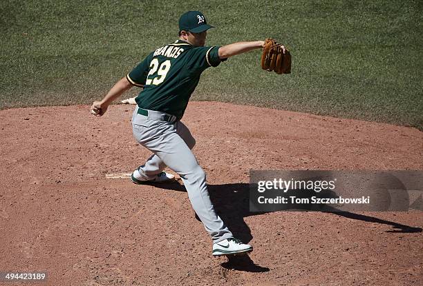 Jeff Francis of the Oakland Athletics delivers a pitch in the eighth inning during MLB game action against the Toronto Blue Jays on May 24, 2014 at...