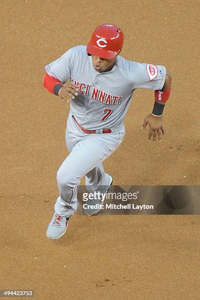 Ramon Santiago of the Cincinnati Reds runs to third base during the game against the Washington Nationals on May 20, 2014 at Nationals Park in...